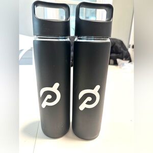 Lot of 2 Glass Peloton water bottles with rubber covers and lids